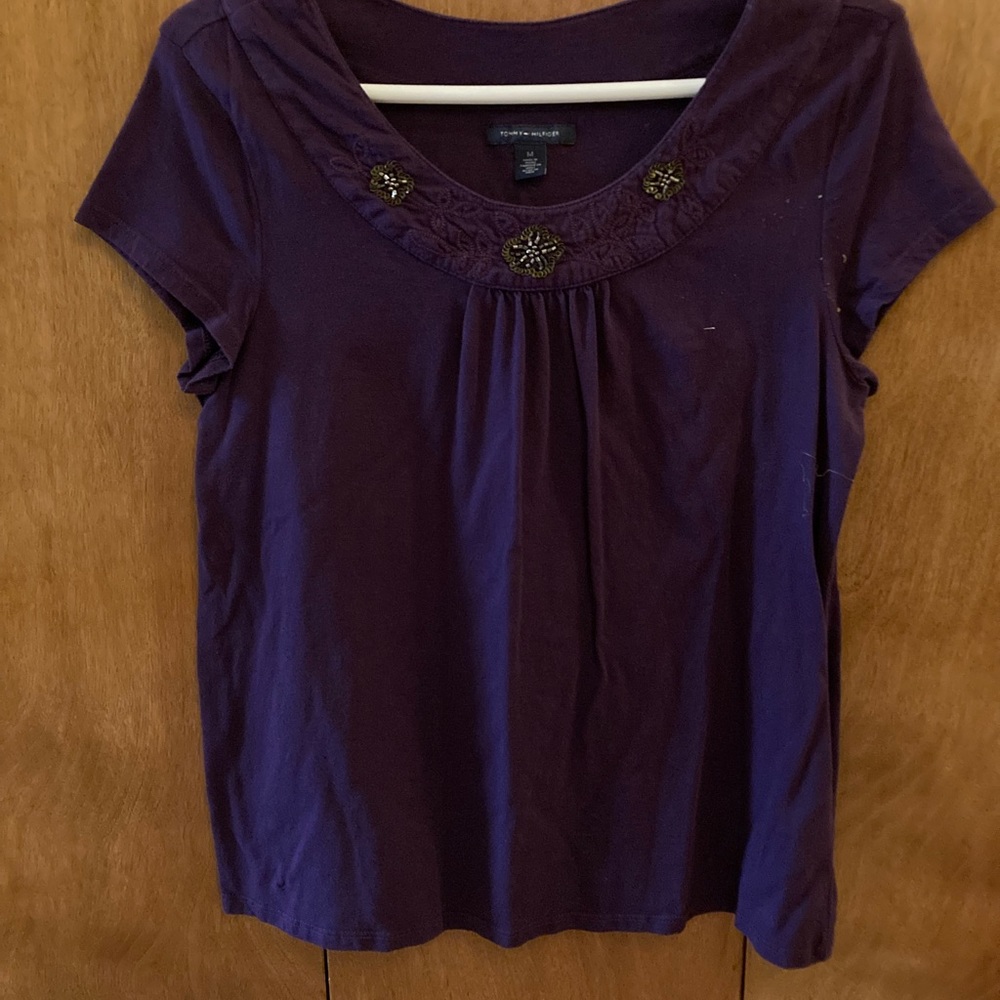Beautiful dark purple top with gold decorations around neck